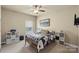 Relaxing bedroom featuring a bed, ceiling fan, and carpet flooring at 1011 Potomac Rd, Indian Trail, NC 28079