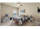Bedroom with a ceiling fan, neutral walls, and large window with blinds at 1011 Potomac Rd, Indian Trail, NC 28079