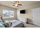 Bright bedroom with a large window, neutral walls, and a comfortable queen bed at 1011 Potomac Rd, Indian Trail, NC 28079