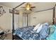 Bedroom with four poster bed, ceiling fan, and string lights at 1011 Potomac Rd, Indian Trail, NC 28079