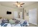 Bedroom featuring a ceiling fan, neutral walls, and two closets at 1011 Potomac Rd, Indian Trail, NC 28079