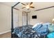 Comfortable bedroom with a unique four-poster bed and ceiling fan at 1011 Potomac Rd, Indian Trail, NC 28079