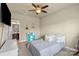 Bright bedroom features a ceiling fan, neutral walls, and cube storage at 1011 Potomac Rd, Indian Trail, NC 28079