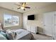 Bright bedroom features a ceiling fan, and a large window that lets in natural light at 1011 Potomac Rd, Indian Trail, NC 28079