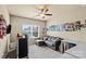 Cozy bedroom with neutral colors, carpet flooring, ceiling fan, and natural light at 1011 Potomac Rd, Indian Trail, NC 28079