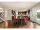 Large dining area with hardwood floors, natural light, with access to the kitchen and backyard at 1011 Potomac Rd, Indian Trail, NC 28079