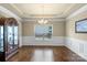 Elegant dining room with hardwood floors, wainscoting, and a chandelier at 1011 Potomac Rd, Indian Trail, NC 28079