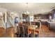 Dining area with hardwood floors open to kitchen and stairs at 1011 Potomac Rd, Indian Trail, NC 28079