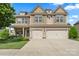 Attractive two-story home with a two car garage, stone accents, and well-maintained landscaping at 1011 Potomac Rd, Indian Trail, NC 28079