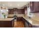 Well-equipped kitchen with granite countertops, stainless steel appliances, and ample cabinet space at 1011 Potomac Rd, Indian Trail, NC 28079