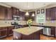 Updated kitchen featuring granite countertops, stainless steel appliances, and a functional center island at 1011 Potomac Rd, Indian Trail, NC 28079