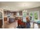 Open kitchen with dark wood cabinets, granite countertops, and stainless steel appliances at 1011 Potomac Rd, Indian Trail, NC 28079