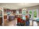 Open concept kitchen and dining area featuring granite countertops and stainless steel appliances at 1011 Potomac Rd, Indian Trail, NC 28079