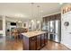 Open kitchen with dark wood cabinets, granite countertops, and stainless steel appliances at 1011 Potomac Rd, Indian Trail, NC 28079
