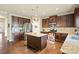 Kitchen features an island, stainless steel appliances, and granite countertops at 1011 Potomac Rd, Indian Trail, NC 28079