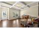 Cozy living room featuring a beautiful coffered ceiling, hardwood floors and a large window at 1011 Potomac Rd, Indian Trail, NC 28079