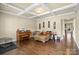 Inviting living room featuring hardwood floors, coffered ceilings, and natural light at 1011 Potomac Rd, Indian Trail, NC 28079
