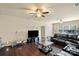Spacious living room with dark hardwood floors and a comfortable leather sofa at 1011 Potomac Rd, Indian Trail, NC 28079