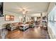 Open concept living room features hardwood floors, neutral paint colors, and comfortable seating arrangements at 1011 Potomac Rd, Indian Trail, NC 28079