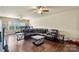 Spacious media room featuring hard wood floors, plenty of space, and a ceiling fan at 1011 Potomac Rd, Indian Trail, NC 28079