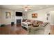 Charming living room featuring a fireplace, hardwood floors, and comfortable couches at 1011 Potomac Rd, Indian Trail, NC 28079
