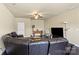 Comfortable living room featuring a large leather sofa and dark hardwood flooring at 1011 Potomac Rd, Indian Trail, NC 28079