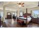 Luxurious main bedroom suite with a four-poster bed and ample natural light at 1011 Potomac Rd, Indian Trail, NC 28079