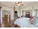 Elegant main bedroom boasts four-poster bed and adjoins bathroom and stairwell at 1011 Potomac Rd, Indian Trail, NC 28079