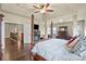 Bright main bedroom featuring a four-poster bed, fireplace, and elegant decor at 1011 Potomac Rd, Indian Trail, NC 28079