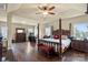 The main bedroom has wood floors, tray ceiling, and a luxurious four-poster bed at 1011 Potomac Rd, Indian Trail, NC 28079