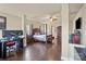 Spacious main bedroom featuring dark wood floors, a four-poster bed, and desk at 1011 Potomac Rd, Indian Trail, NC 28079