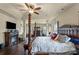 Elegant main bedroom with a cozy fireplace and a luxurious four-poster bed at 1011 Potomac Rd, Indian Trail, NC 28079
