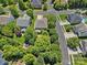 Aerial view shows the home has a private backyard with a trampoline and is located on a quiet street at 1012 Sudbury Ln, Matthews, NC 28104