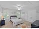 Cozy bedroom with neutral tones, a queen bed, stylish rug, and double door closet at 1012 Sudbury Ln, Matthews, NC 28104