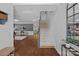 Open foyer with hardwood floors, a staircase, and views into the living room at 1012 Sudbury Ln, Matthews, NC 28104