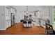 Gourmet kitchen with granite countertops, stainless steel appliances, a large island and hardwood floors at 1012 Sudbury Ln, Matthews, NC 28104