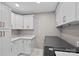 Well organized laundry room with built in cabinetry and modern washer and dryer at 1012 Sudbury Ln, Matthews, NC 28104