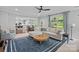 Spacious living room with an open layout to the kitchen and dining areas, and large windows at 1012 Sudbury Ln, Matthews, NC 28104