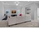Upstairs living room with a TV, comfortable seating, and built in shelves at 1012 Sudbury Ln, Matthews, NC 28104