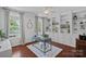 Stylish home office with custom built-in shelving, hardwood floors, and ample natural light at 1012 Sudbury Ln, Matthews, NC 28104