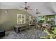 Screened-in patio with slate flooring, a vaulted ceiling, and views of the landscaped backyard at 1012 Sudbury Ln, Matthews, NC 28104