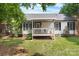 Backyard with a cozy porch and lush green grass at 103 Pine Meadows Cir, Hickory, NC 28601