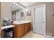 Cozy bathroom featuring light wood cabinetry, white countertops, and modern vanity lighting at 103 Pine Meadows Cir, Hickory, NC 28601