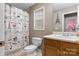 Bathroom featuring a shower curtain, toilet, vanity, and framed art at 103 Pine Meadows Cir, Hickory, NC 28601