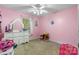 Pink ' bedroom with decorations, a ceiling fan, a window, and carpeted floors at 103 Pine Meadows Cir, Hickory, NC 28601