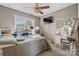 Bedroom with a window, ceiling fan, small television, toys and a comfortable bed at 103 Pine Meadows Cir, Hickory, NC 28601