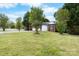 Spacious front yard with lush grass and a charming home with a two-car garage at 103 Pine Meadows Cir, Hickory, NC 28601