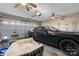 Spacious garage featuring white walls, ceiling fans, and parking for one vehicle at 103 Pine Meadows Cir, Hickory, NC 28601
