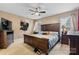 Spacious bedroom with a large bed, a ceiling fan and two windows for ample natural light at 103 Pine Meadows Cir, Hickory, NC 28601