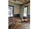 Renovation project featuring wood trim and natural light from windows, offering potential for a personalized space at 105 E Second Ave, Mount Gilead, NC 27306